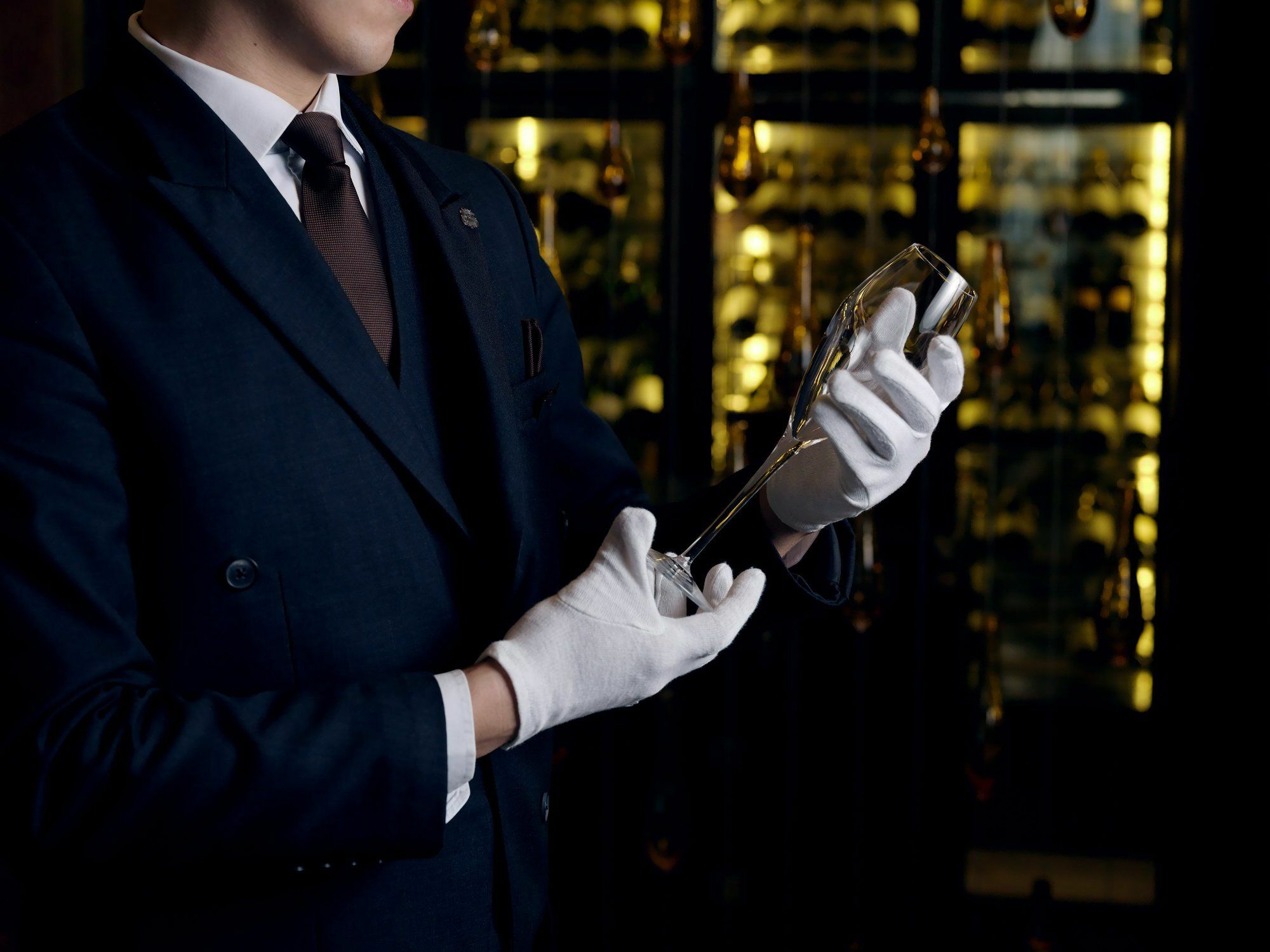 Готель The St. Regis Astana Екстер'єр фото A sommelier inspecting a bottle of wine